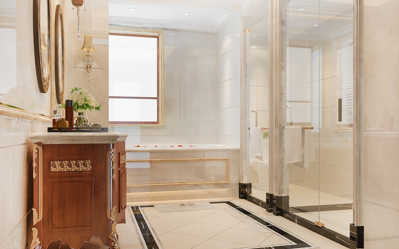 A bathroom with a glass partition