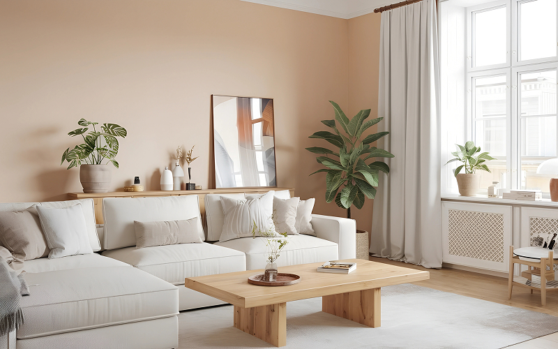 A neutral-toned living room with muted accents and soft wall colours