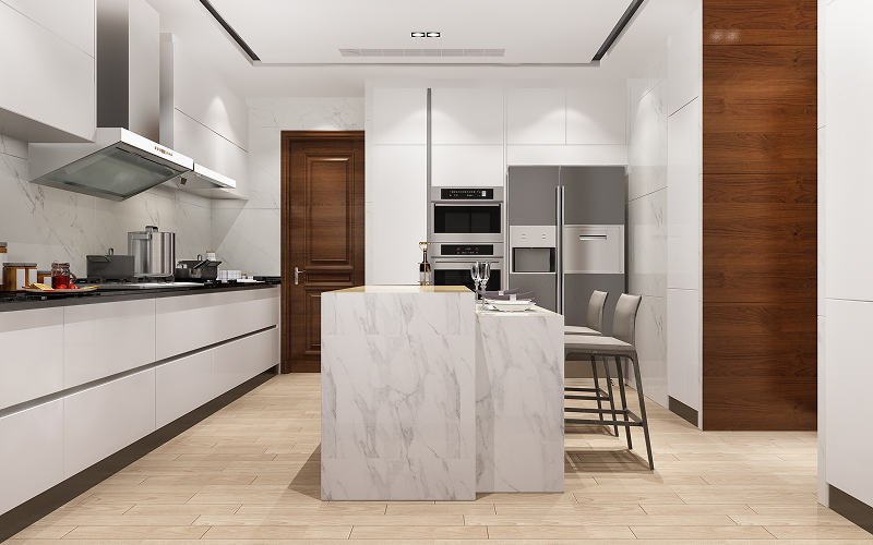 A stock photo of a kitchen with stone countertops and integrated appliances.