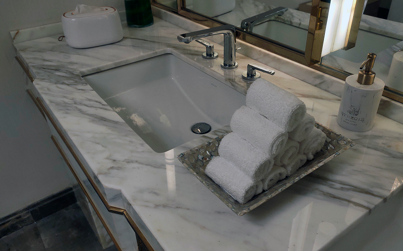 A stock photo of a marble or quartz bathroom details.