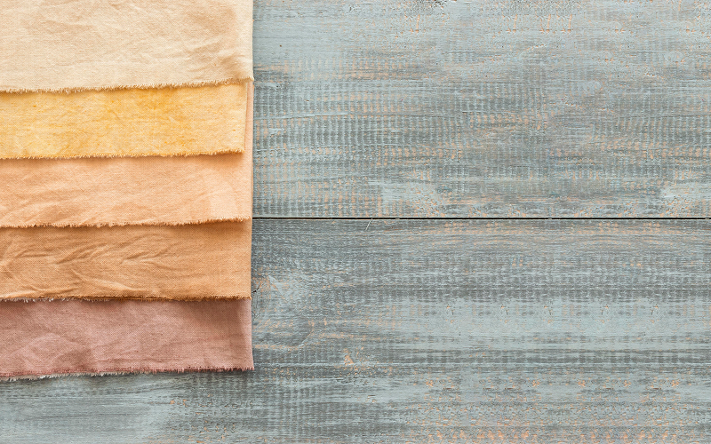 A stock photo of textured fabrics and layered materials.