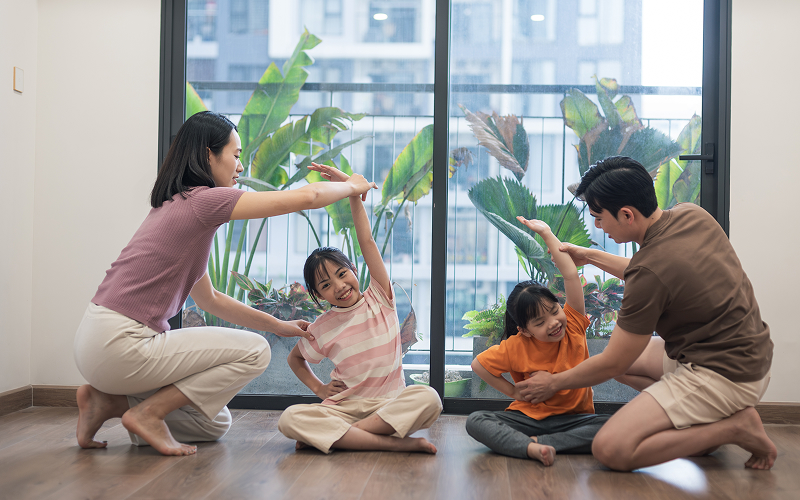 A family interacting in a condo space