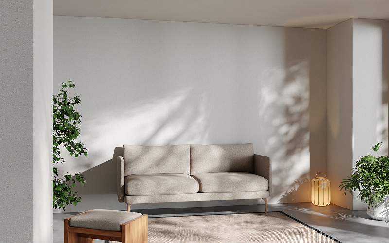 A minimalist condo living room with soft neutral tones
