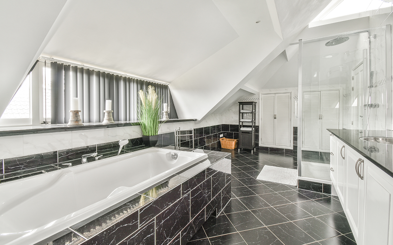 An image of a bathroom with stylish tiles and clean fixtures.
