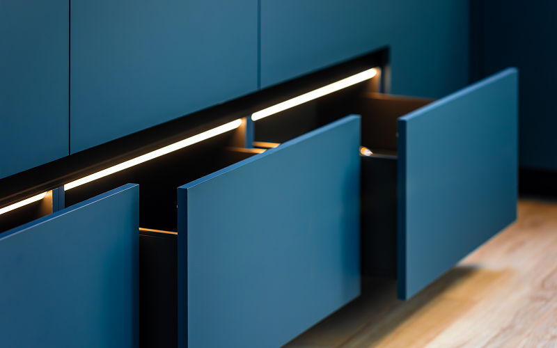 Sleek built-in cabinetry with flush panels blending seamlessly into the wall